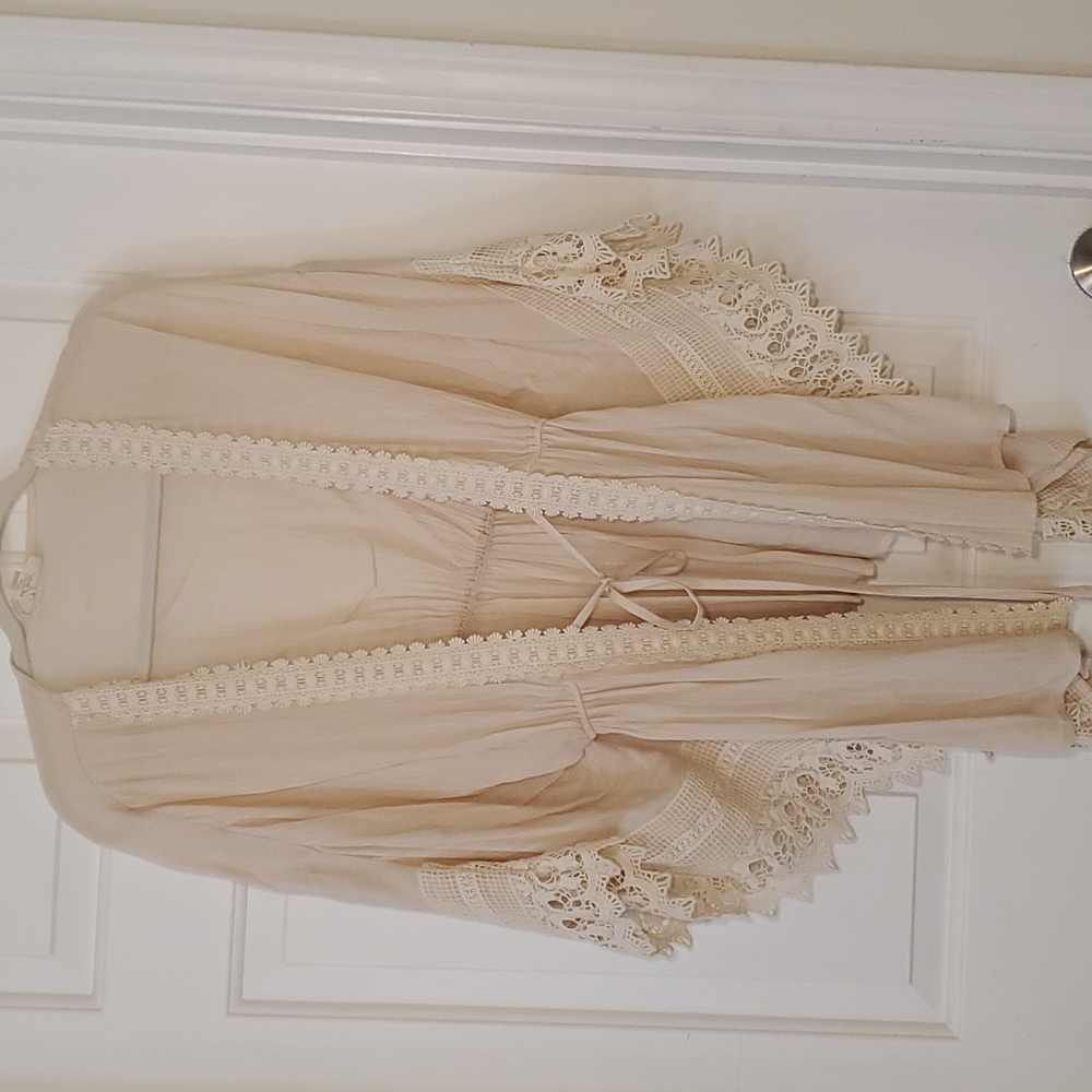 26"long. Sexy cream cardigan, free flow.